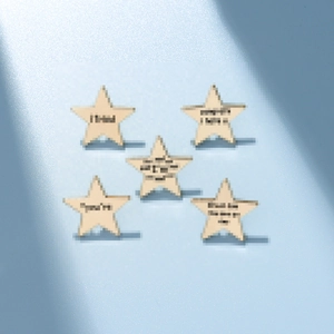 Five-piece set of star-shaped wooden pins featuring inspirational quotes on blue backdrop