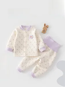 Detailed view of quilted cotton baby sleepwear set featuring delicate floral patterns