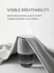 Breathable grey cotton knit baby jumpsuit showing steam ventilation through fabric