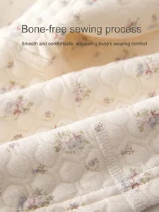 Close-up of baby warm quilted cotton underwear with purple floral print and flat seam detail