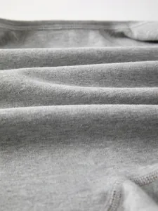 Detail of soft cotton fabric showing breathable texture for baby rompers and clothing