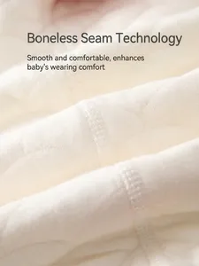 Quilted baby bodysuit in soft off-white cotton featuring comfortable boneless seams