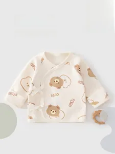 Detail of soft cotton newborn kimono top with bear print and side tie closure