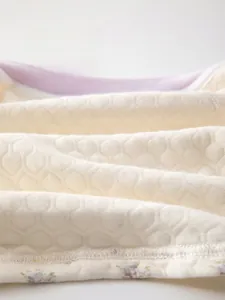 Close-up of soft cotton honeycomb quilted fabric with breathable and moisture-wicking texture