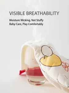 Breathable padded baby romper with yellow animal prints and steam demonstration of airflow