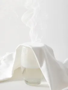 Breathable pure cotton newborn long sleeve bodysuit showing steam passing through fabric