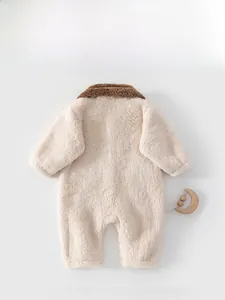 Detailed back view of a plush cream-colored baby winter romper with soft brown fur trim