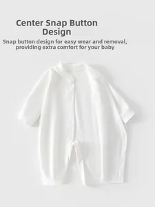 Detail of white cotton baby romper featuring easy-snap front closure for convenient dressing