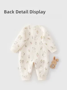 Back view detail of quilted cotton baby romper with purple floral and bunny patterns