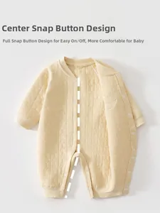 Close-up of quilted cotton baby romper with center snap buttons and star moon embossing