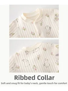 Detail of newborn bodysuit neckline featuring rabbit tulip print and resin snap buttons
