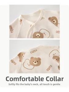 Detail of soft cotton baby top with cute bear print and safe snap buttons on neckline