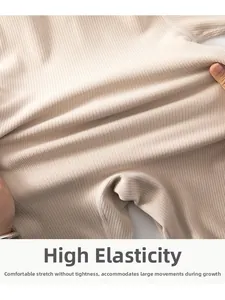 Macro shot showing high elasticity and soft rib texture of baby thermal bodysuit
