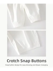 Close-up of the snap button fasteners on white organic cotton baby romper jumpsuit