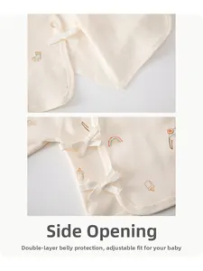 Detail of newborn cotton wrap top with rainbow print and adjustable side tie closure