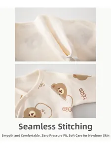 Detail of boneless sewing on cotton newborn baby top with cute brown bear prints
