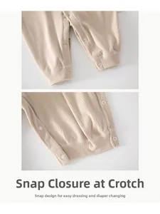 Detail view of snap buttons on baby ribbed romper for easy diaper changing and comfort