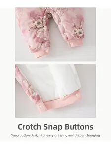 Detail of snap button crotch on floral baby romper for easy diaper changes