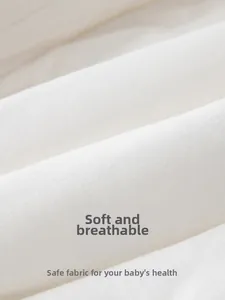 Close-up of soft breathable fine-spun cotton fabric used in baby winter rompers