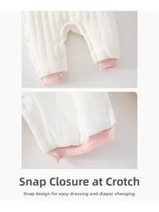 Detail of snap button crotch on quilted baby romper for easy diaper changes