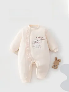 Detail of baby cotton jumpsuit with ruffle edge and cute rabbit embroidery