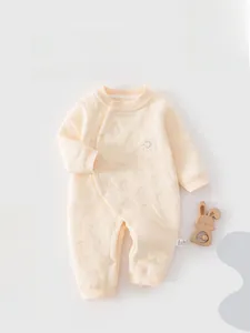 Detail of baby winter romper showing elephant embroidery and quilted texture