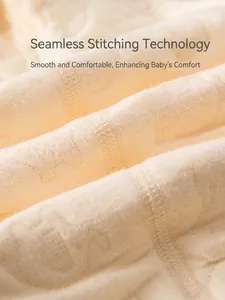 Flat-seam detail on a thick warm cotton baby romper showing smooth stitch texture