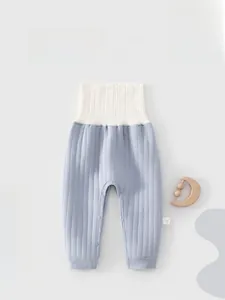 Detail of baby quilted high waist thermal pants with snap buttons for easy diaper change