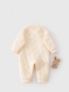 Detail view of baby rompers back side featuring textured elephant embossed fabric and soft cotton