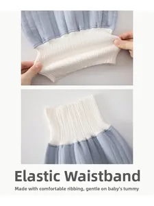 Detail of high-waist elastic ribbing on light blue quilted cotton baby thermal pants