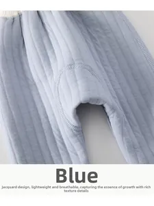 Detail of blue quilted baby pants showing high-quality vertical jacquard knit texture