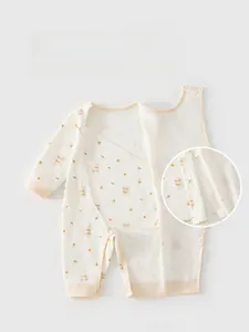 Detail of baby cotton onesie featuring double-layer belly protection and snap closures