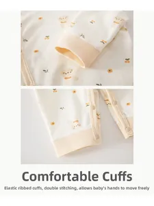 Detail of baby cotton romper showing elastic ribbed cuffs and double stitching for comfort