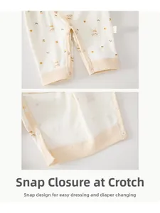 Close-up detail of snap buttons on baby cotton romper for easy diaper changes