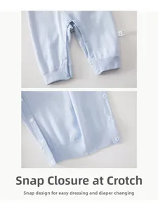 Detail view of crotch snap buttons on 100% cotton baby romper for easy diaper changes