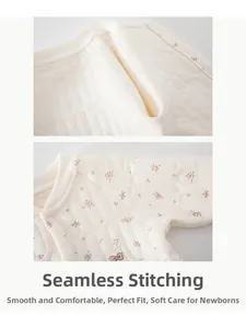Détail d'un body matelassé pour bébé avec coutures sans os et broderie à motif floral