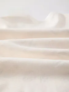 Detailed macro view of soft breathable pure cotton knit fabric for baby sleeping bags