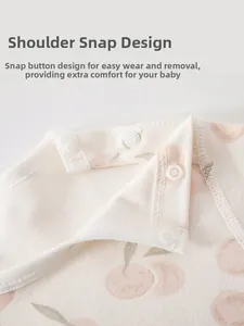 Close-up of shoulder resin snaps on pure cotton baby sleeping bag with peach prints