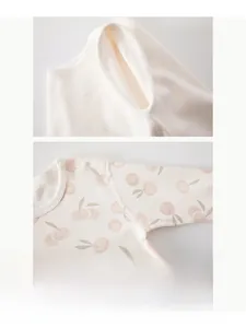 Close-up of baby romper showing seamless boneless stitching and peach fruit patterns