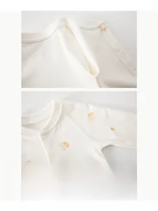 Détail de couture sans os et imprimé carotte sur barboteuse en coton doux pour bébé