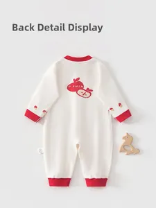 Detail show of baby cotton romper back with red apple print and ribbed cuffs