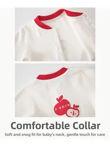 Detail showing the red ribbed neckline and soft cotton texture of the newborn bodysuit