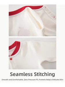 Detail of boneless stitching on soft cotton baby bodysuit with red rib trim edges