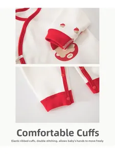 Detail of red ribbed cuffs and double stitching on baby cotton bodysuit with bear print