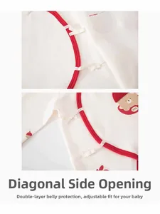 Detail of baby cotton bodysuit featuring side-opening ties and double-layer belly protection