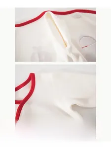 Detail of boneless stitching on newborn cotton romper showing soft neckline and seams
