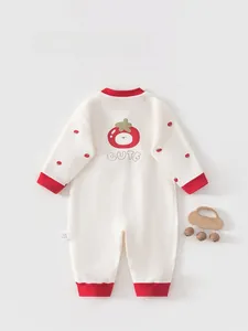 Close-up of baby romper back featuring cute cartoon print and red ribbed trim details