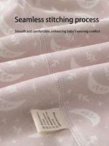 Pink infant bodysuit with moon and star prints and flat seam stitching detail