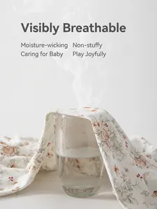 Breathable pure cotton floral baby romper showing steam passing through the fabric