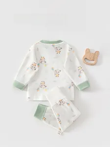 Detailed view of baby panda print sleepwear set with soft ribbed necklines and tags